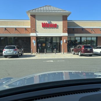 Wawa - the front of a restaurant with cars parked in front of it - Gas Stations Near Me - Ewing, New Jersey