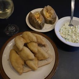 Single perch dinner - yes, you get two baked potatoes. Single perch dinner - yes, you get two baked potatoes.