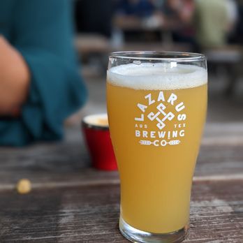 Lazarus Brewing - a glass of beer on a table - Breweries Near Me - Austin, Texas Lazarus Brewing - a glass of beer on a table - Breweries Near Me - Austin, Texas