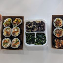 Shrimp tempura Kimbap, banchan, BBQ pork kimbap, and sauces Shrimp tempura Kimbap, banchan, BBQ pork kimbap, and sauces