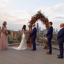 Renewing wedding vows with high views of the city and a drone recording the ceremony