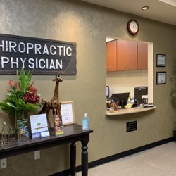 Back to Wellness Chiropractic - It's hard to see, but we have a countertop protective barrier. Lobby.