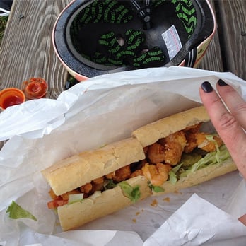 Cajun Joe's Seafood - Shrimp po boy, dressed. YUM. And be sure to eat that spicy sauce you see on the left hand side--soooooo good. - Seafood Near Me - New Orleans, Louisiana