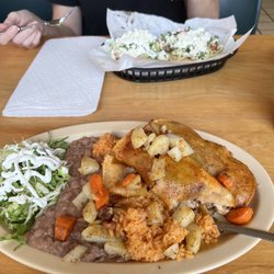 Taqueria Mi Sabino - 4 people enchiladas with beef, rice and beans. Also two sope.