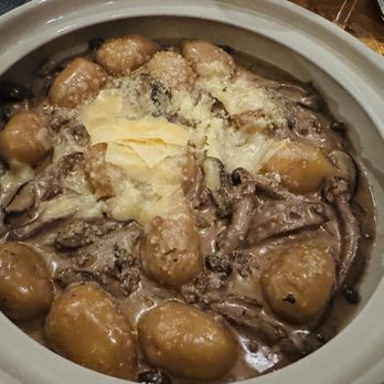 Capriccio - Homemade Gnocci in a delicious shiitake mushroom and Gouda cheese sauce - Italian Near Me - Miami, Florida Capriccio - Homemade Gnocci in a delicious shiitake mushroom and Gouda cheese sauce - Italian Near Me - Miami, Florida