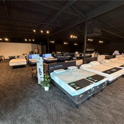 Healthy Zzz’s Sit N’ Sleep - Another look inside the showroom highlighting multiple mattress brands and comfort levels in a relaxed, easy-to-shop environm...