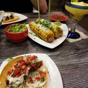 Pescado Borracho - Baja fish taco, Chips & salsa, Fresh guacamole, Spicy street corn, and a Frozen mangorita - Mexican Near Me - Gilbert, Arizona Pescado Borracho - Baja fish taco, Chips & salsa, Fresh guacamole, Spicy street corn, and a Frozen mangorita - Mexican Near Me - Gilbert, Arizona