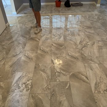 Bob Gray Tile & Flooring - a man standing in a living room - Flooring Near Me - Myrtle Beach, South Carolina