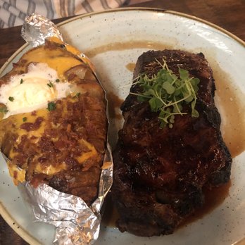Le Moo - New York Strip with Baked Potato - Steakhouses Near Me - Louisville, Kentucky Le Moo - New York Strip with Baked Potato - Steakhouses Near Me - Louisville, Kentucky