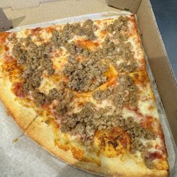 Boardwalk Pizza - Crumbled sausage slice special, they also have sliced sausage on request
