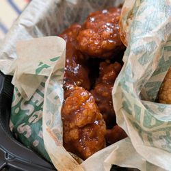 Wingstop - Atomic - it is spicy but not unbearable.  It doesn't taste good though.