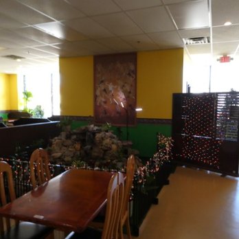 Daw Kun Thai - Small part of the dining area, with fountain in the background - Thai Near Me - Manchester, New Hampshire Daw Kun Thai - Small part of the dining area, with fountain in the background - Thai Near Me - Manchester, New Hampshire