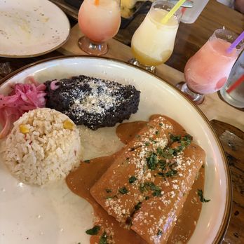 Carmelita's Kitchen + Tequila - The margarita flight (I got prickly pear, passion fruit and raspberry) and the Braised Sherry Enchiladas with matamoros beef. - Mexican Near Me - Cypress, Texas