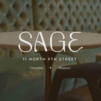 Sage - a table and chairs in front of a wall - Coffee & Tea Near Me - Columbia, Missouri Sage - a table and chairs in front of a wall - Coffee & Tea Near Me - Columbia, Missouri