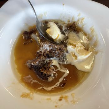 Taste of Poland - Sticky Toffee Pudding: A warm, moist date sponge cake soaked in luscious toffee sauce, served with a scoop of velvety vanilla ice cream - Polish Near Me - Tulsa, Oklahoma Taste of Poland - Sticky Toffee Pudding: A warm, moist date sponge cake soaked in luscious toffee sauce, served with a scoop of velvety vanilla ice cream - Polish Near Me - Tulsa, Oklahoma