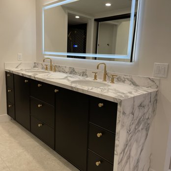 Prestige Granite - a bathroom vanity with two sinks and a large mirror - Countertop Installation Near Me Prestige Granite - a bathroom vanity with two sinks and a large mirror - Countertop Installation Near Me