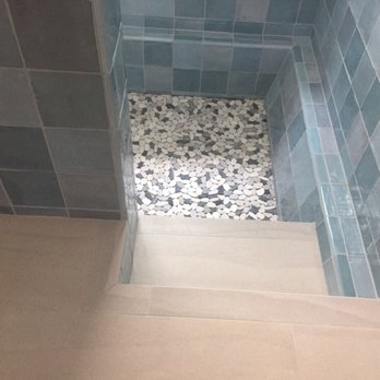 Tile Elements - A beach themed bathroom: porcelain tiles that look like sand, pebble tiles for the shower basin, aqua tiles for the walls. - Building Supplies Near Me - Santa Ana, California