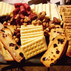Grocery Outlet - Red wine infused cheese, 9 month cheddar, Porter Beer cheese, blueberry lemon crackers and butter crackers with beef sausage.