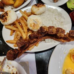 Pollos El Paisa - Fried pork belly. Rice cakes. FF, rice.