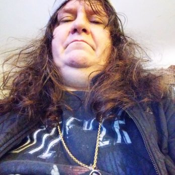 Main Street Pizza - a woman with her eyes closed - Pizza Near Me - Williamsburg, Ohio Main Street Pizza - a woman with her eyes closed - Pizza Near Me - Williamsburg, Ohio