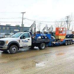 Rent Rite Equipment - Delivery truck with JLG scissor lift.
