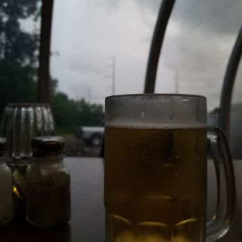 Hugo's Pizza - a glass of beer on a table - Pizza Near Me - Ashland, Wisconsin