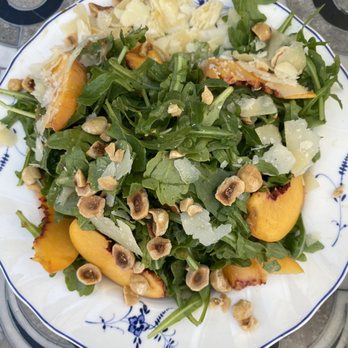 Margot - Wild arugula salad w peaches, pistachios and hazelnuts. Very good! - Spanish Near Me - Culver City, California