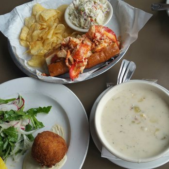 Sam's Chowder House - Award winning lobster roll with a side of Cole slaw and chips,  crab cake with a side of beet salad and tarter sauce,  and clam chowder - Seafood Near Me - Half Moon Bay, California