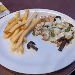 Buzz Inn Steakhouse - My half of the Chicken Philly Sandwich w/o bun for $16.99.