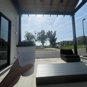 Graham's Coffee - a person holding a cup of coffee - Coffee & Tea Near Me - Gallatin, Tennessee