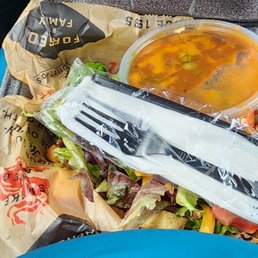 The salad, fork and chili