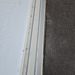 Sea Turtle Home Cleaning - Sliding door tracks not vacuumed out.