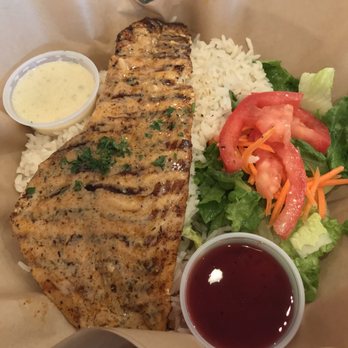 Hook'd Fish Grill - Red snapper with rice and salad - Seafood Near Me - Northridge, California Hook'd Fish Grill - Red snapper with rice and salad - Seafood Near Me - Northridge, California