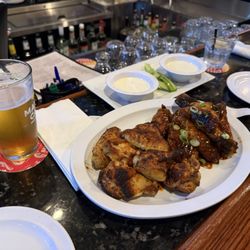 The Pub at Safety Harbor - Half medium (on the left) half Dee's wings (on the right). Very good wings! Served with house made ranch dressing.