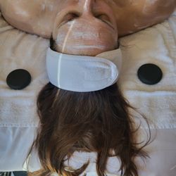 Nourishing facial treatment with a hot stone hand and arm massage.