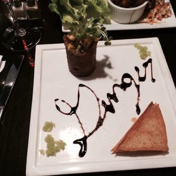 Ginger - The spicy tuna tower with soy sauce reduction written with GINGER. - Asian Fusion Near Me - Anchorage, Alaska