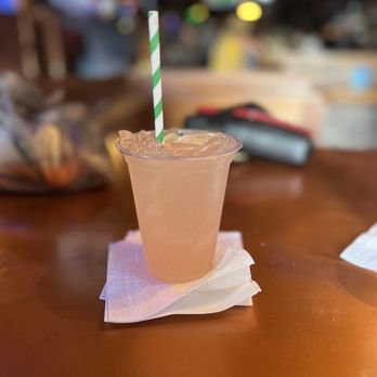 Irish Kevin's - a drink in a plastic cup with a straw - Bars Near Me - Key West, Florida