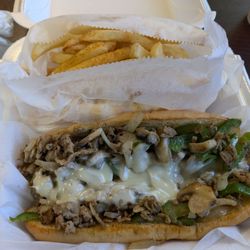 J Buffalo Wings - Philly cheese steak with side of fries.