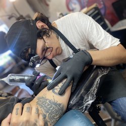 Red Shores Tattoo - piercings tattoos