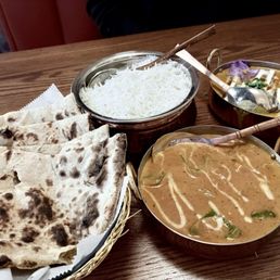 Tandoori Roti (left), white rice, Taj Stuffed Paneer (top right), Chicken Tikka Masala (bottom right)