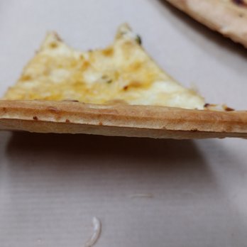Pitsa - a hand holding a piece of pizza - Pizza Near Me - Glen Allen, Virginia