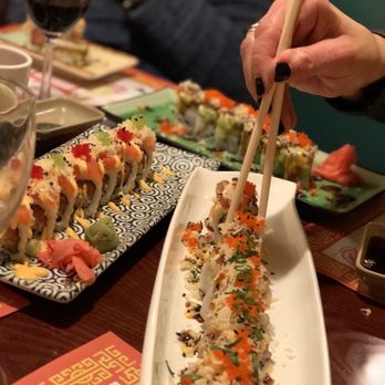Oriental Pearl - a person eating sushi with chopsticks - Chinese Near Me - Haddonfield, New Jersey