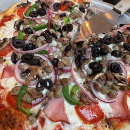 Nice selection of toppings but the dog treat sausage and bland sauce spoiled the beautiful crust on this pie. Nice selection of toppings but the dog treat sausage and bland sauce spoiled the beautiful crust on this pie.