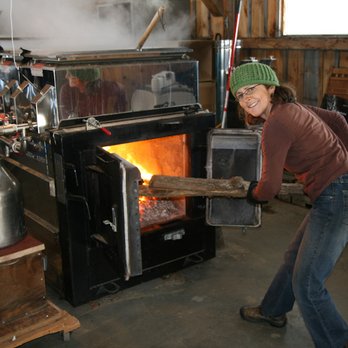 Justamere Tree Farm - Marian loading the evaporator! - Specialty Food Near Me - Worthington, Massachusetts Justamere Tree Farm - Marian loading the evaporator! - Specialty Food Near Me - Worthington, Massachusetts