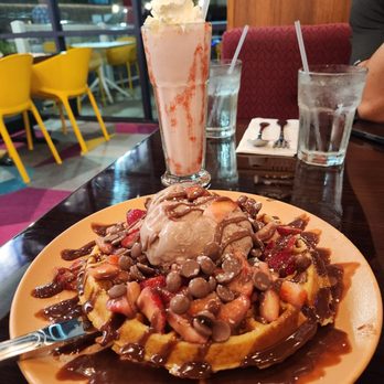 White Rabbit Dessert Experience - Chocolate ice cream, strawberries, Belgian chocolate buttons with Belgian chocolate sauce on top of waffles. - Desserts Near Me - Orlando, Florida