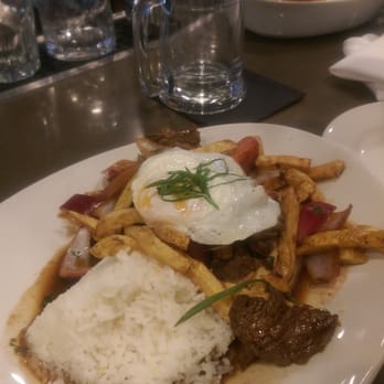 Puerto 27 Peruvian Kitchen & Pisco Bar - Lomo Saltado with fried egg just luke they do it in Brazil. Amazing flavor - Peruvian Near Me - Pacifica, California Puerto 27 Peruvian Kitchen & Pisco Bar - Lomo Saltado with fried egg just luke they do it in Brazil. Amazing flavor - Peruvian Near Me - Pacifica, California