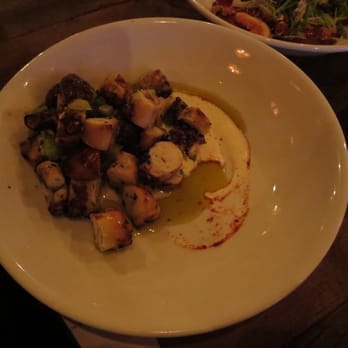 Southbound - Wood Grilled Octopus - smoked potatoes, persillade, creme fraiche, green tomatoes. - Southern Near Me - Chamblee, Georgia Southbound - Wood Grilled Octopus - smoked potatoes, persillade, creme fraiche, green tomatoes. - Southern Near Me - Chamblee, Georgia