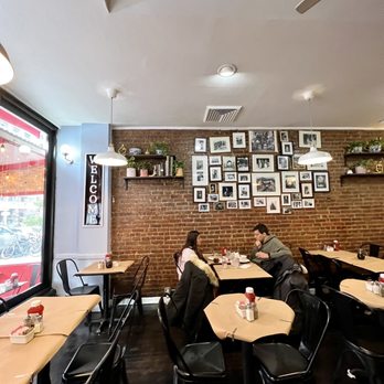 Effy's Cafe - a man sitting at a table - Cafes Near Me - New York, New York