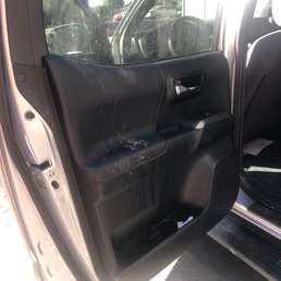 Behind the driver's seat