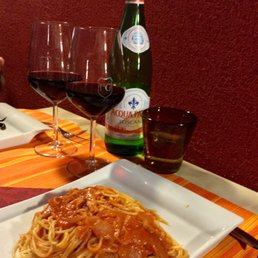 House wine, still water and pasta All'Amatriciana